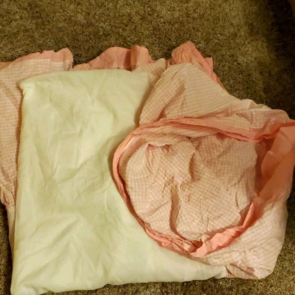 Pink and white checkered crib skirt